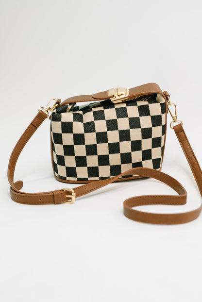 Front view of Send a Check Crossbody Bag showing checkered print and buckle closure.
