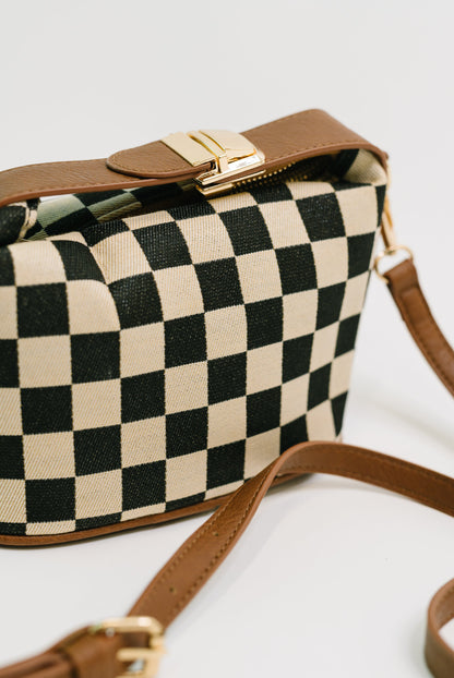 Close up of Send a Check Crossbody Bag checkered pattern and PU leather trim.