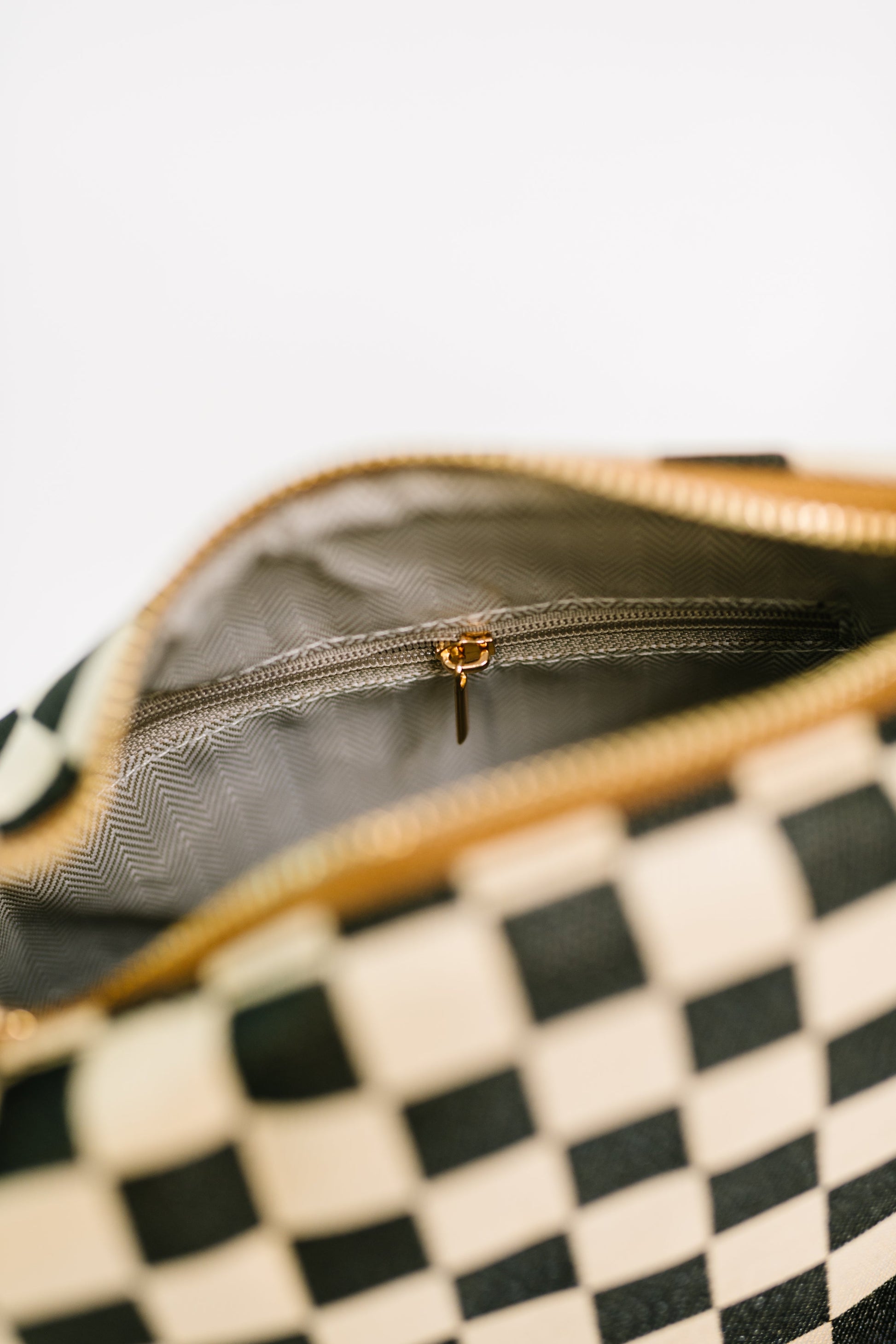 Interior of Send a Check Crossbody Bag canvas bag with zipper and pockets.