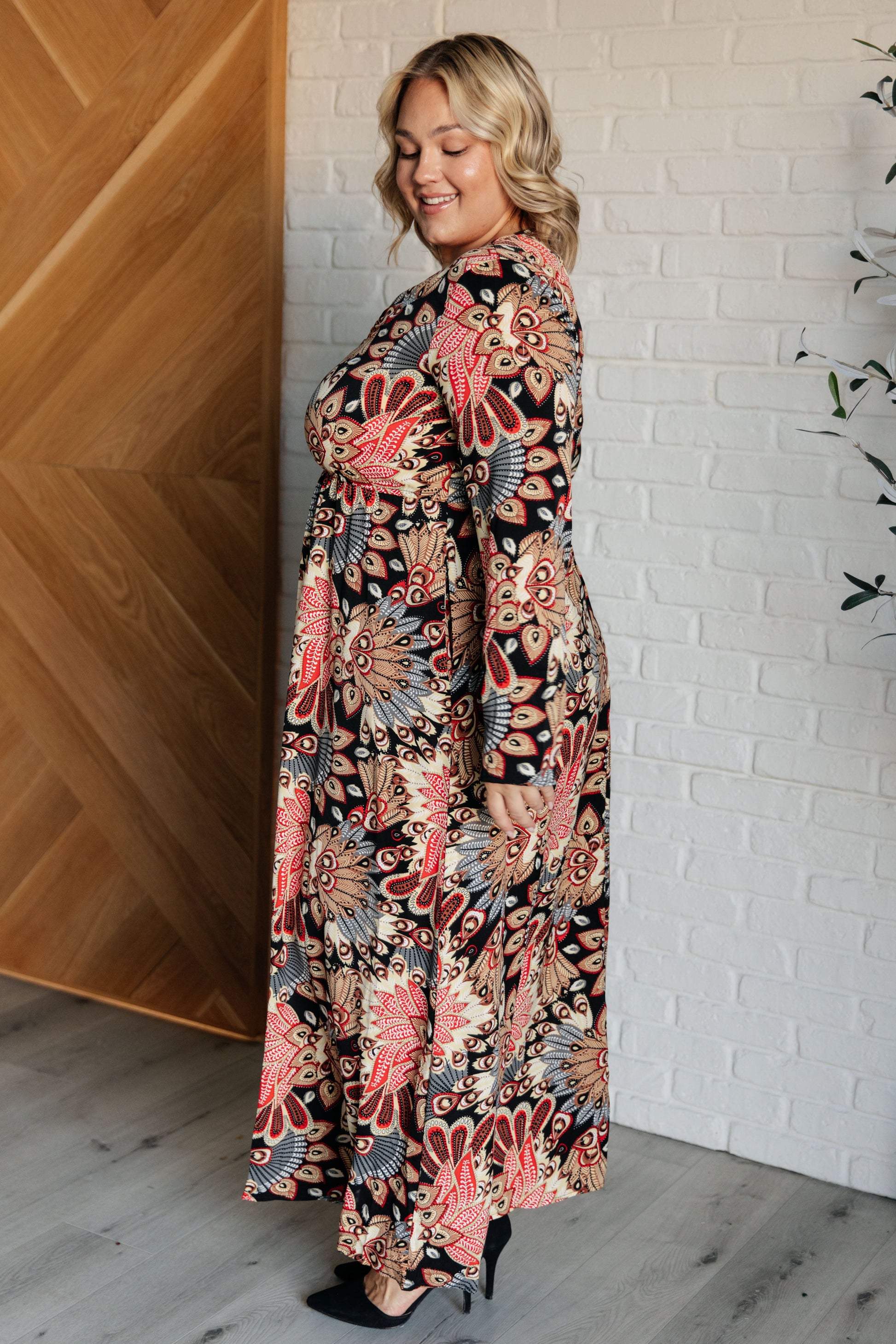 Women's floral multicolor Orla Faux Wrap Maxi Dress with a V-neckline, long sleeves, high elastic waistline, A-line silhouette, snap button closure, and functional side pockets, made from poplin woven fabric. 