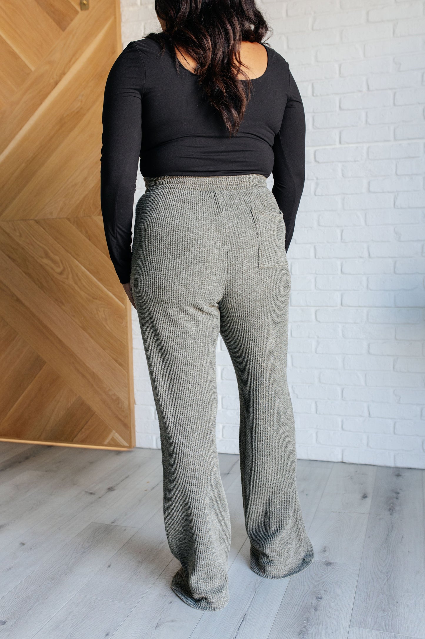 Mineral Wash Waffle Knit Pants in olive with a slightly wide leg, raw edge details, patch pockets, and an adjustable drawstring waistband for a cozy, stylish fit.