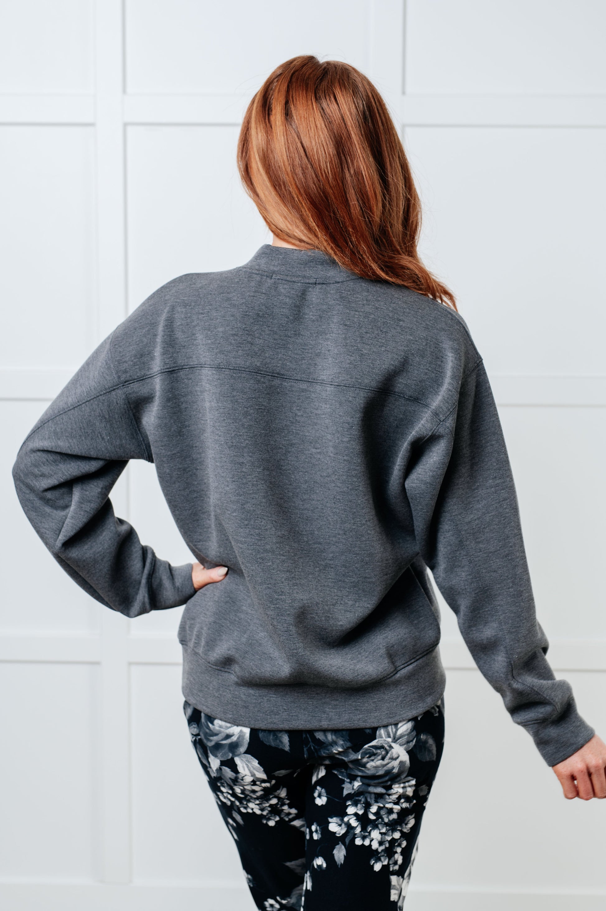 A women's gray sweatshirt made from micro scuba knit fabric, featuring a mock neckline, long sleeves, and a relaxed fit.