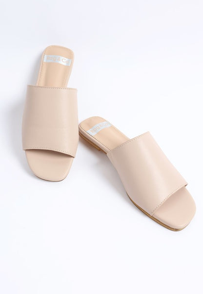 Angled view of Shanon Slip-On Leather Flats in Beige square toe silhouette.