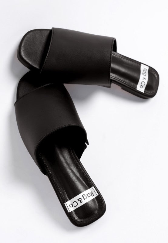 Close up of Shanon Slip-On Leather Flats in Black leather texture and stitching.