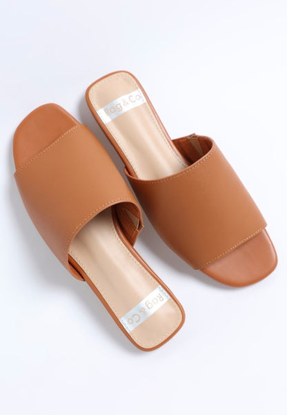 Flat lay of Shanon Slip-On Leather Flats in Tan casual slip on flats.
