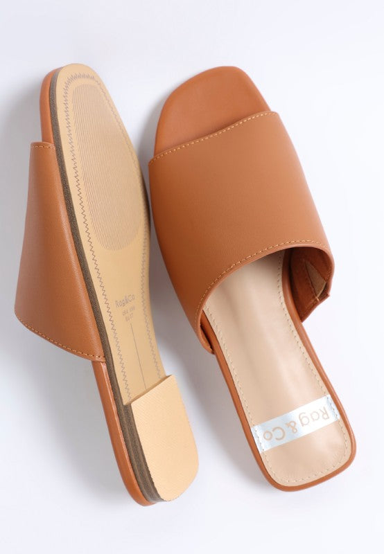 Close up of Shanon Slip-On Leather Flats in Tan leather texture detail.