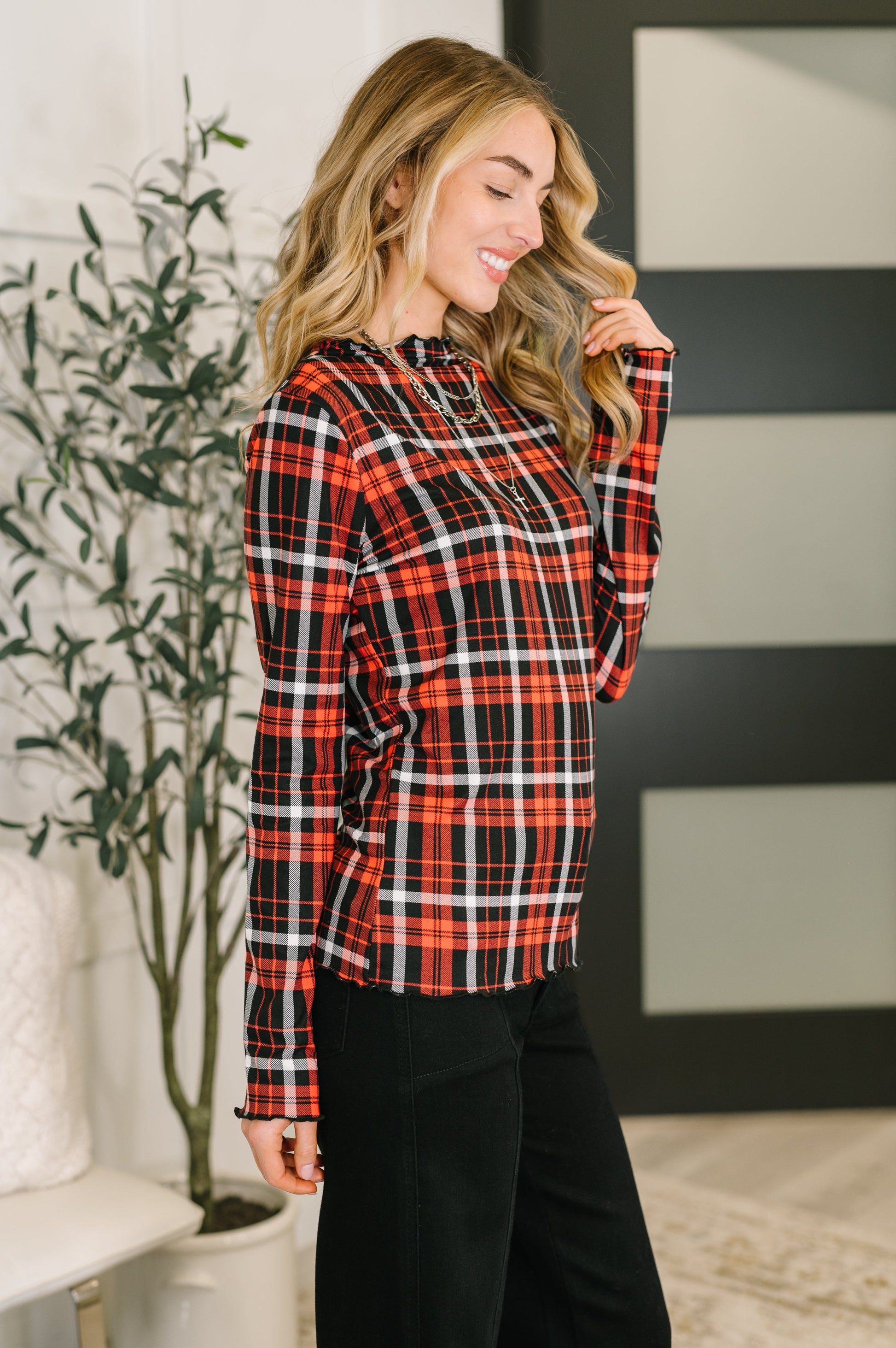 Side angle of Shane Plaid Lettuce Hem Top highlighting form-fitting cut.