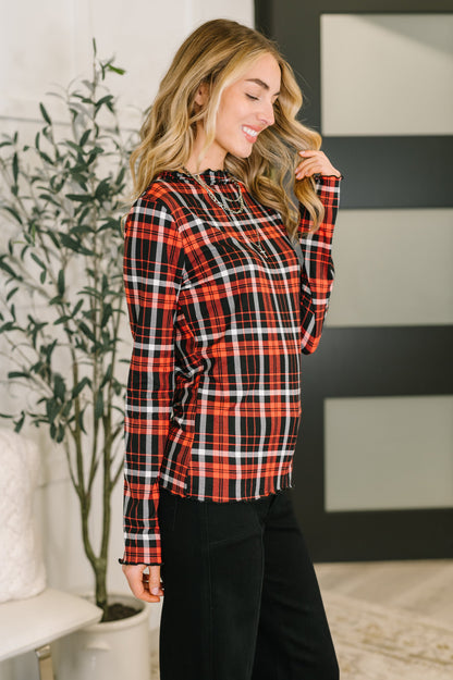 Side angle of Shane Plaid Lettuce Hem Top highlighting form-fitting cut.