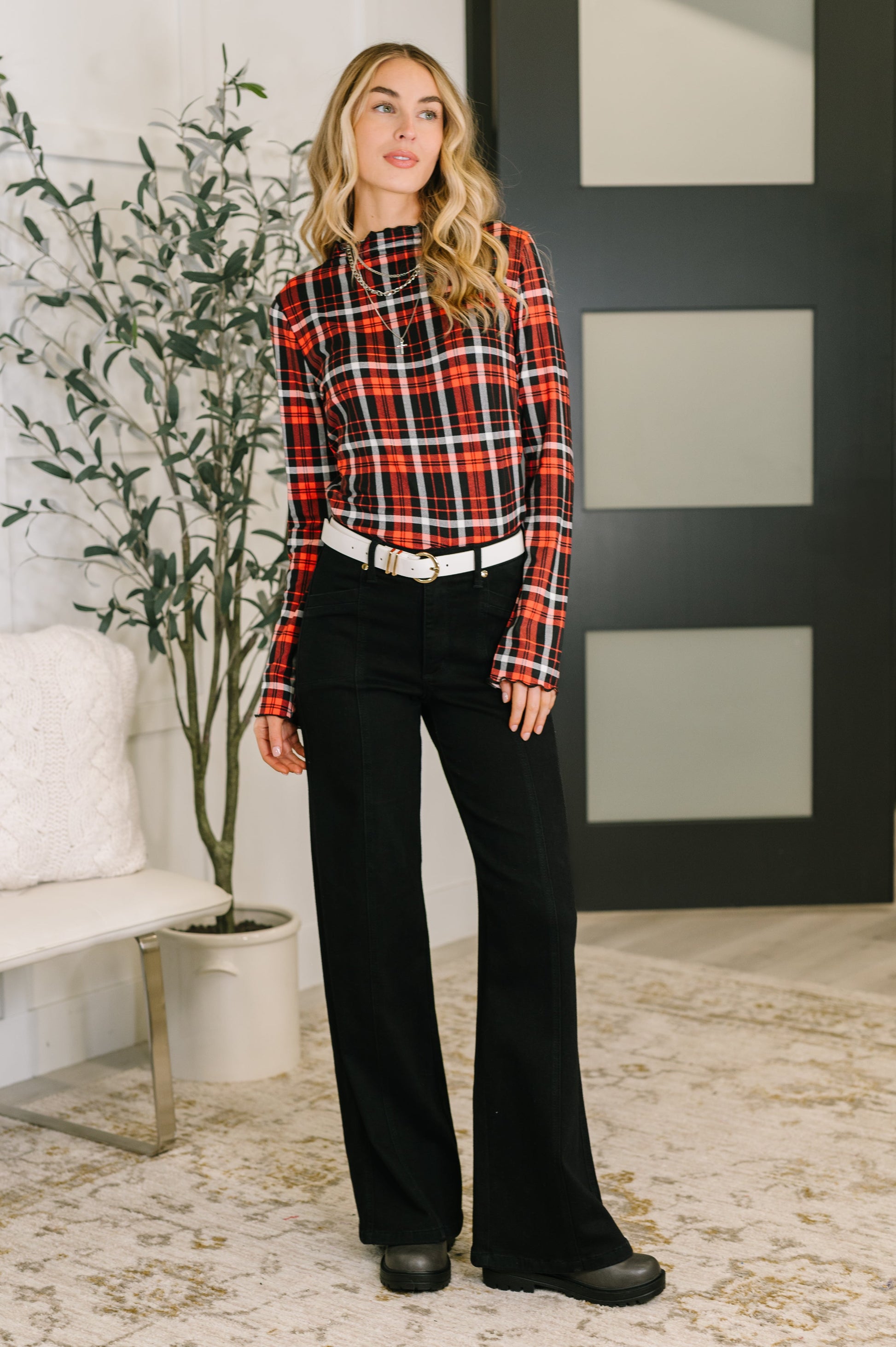 Shane Plaid Lettuce Hem Top styled with jeans for a trendy, casual outfit.