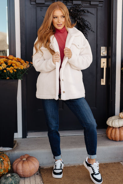 Model wearing Shreya Sherpa Coat layered with jeans and sneakers for a winter-ready look.