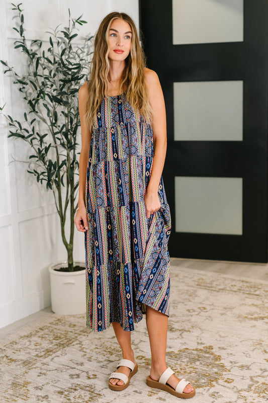 Front view of Sierra Gathered Tiered Dress in navy with sleeveless cut, scooped neckline, and flowy tiered silhouette.