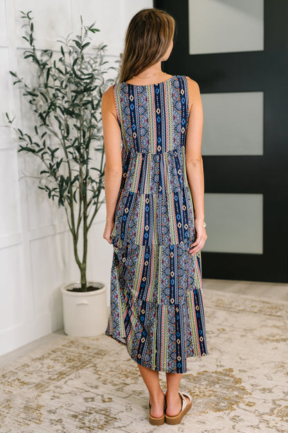 Back view of Sierra Gathered Tiered Dress with sleeveless cut and tiered gathered silhouette in navy knit.
