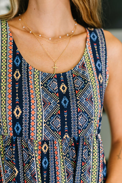 Close-up of Sierra Gathered Tiered Dress showing scooped neckline, sleeveless detail, and gathered tiered knit fabric.