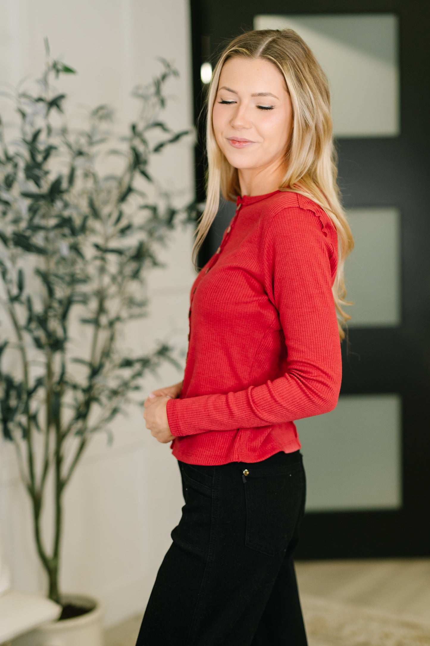 Side angle of Sigourney Button Down Cardigan highlighting ribbed knit texture.