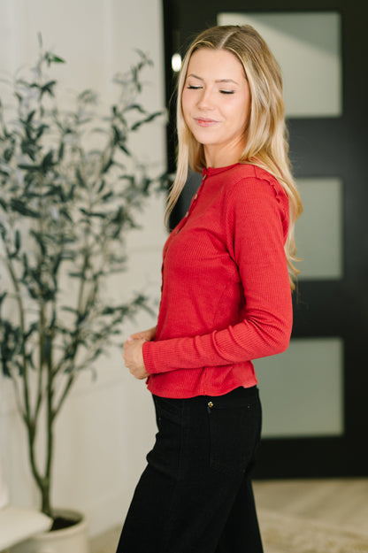 Side angle of Sigourney Button Down Cardigan highlighting ribbed knit texture.