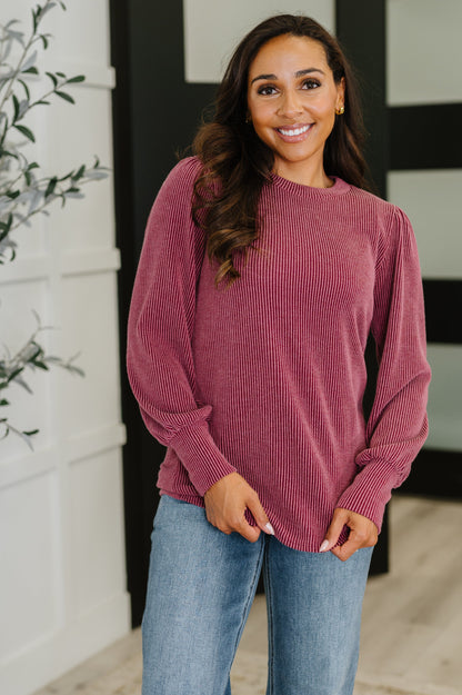 Model wearing Shannon Balloon Sleeve Knit Top in berry, cable ribbed knit with round neckline