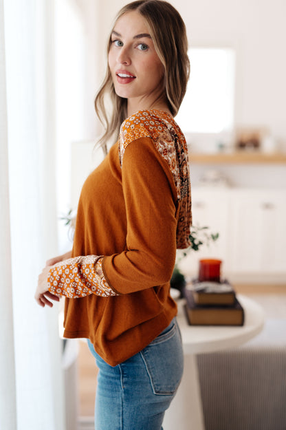 Side profile of Trissie Mixed Print Hoodie, showing patterned sleeve cuff and relaxed silhouette.
