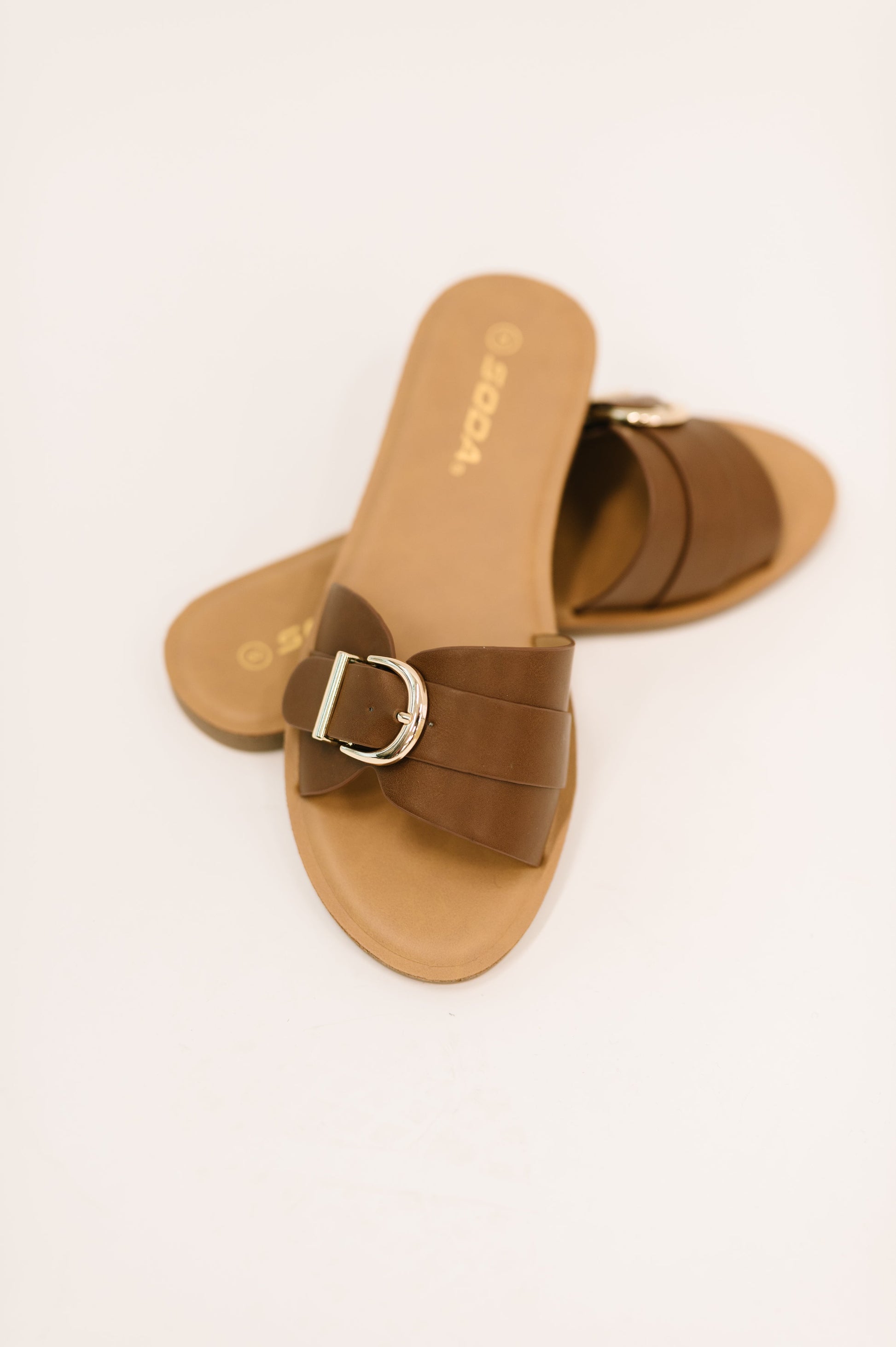 Front view of Siran Dark Tan Slip-On Sandals by Soda showing round open toe design.