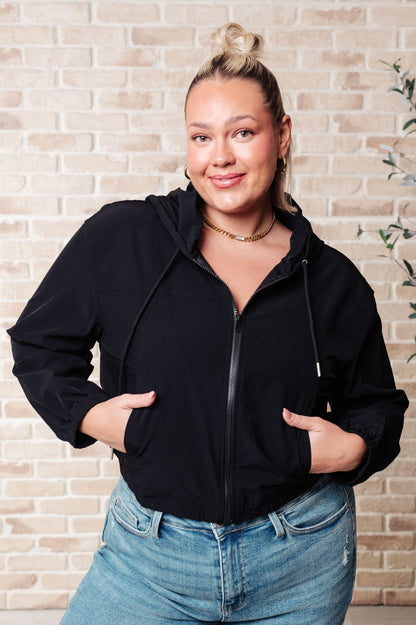 Front view of plus size Sky Zip Up in Black showing elastic waistband and pockets.