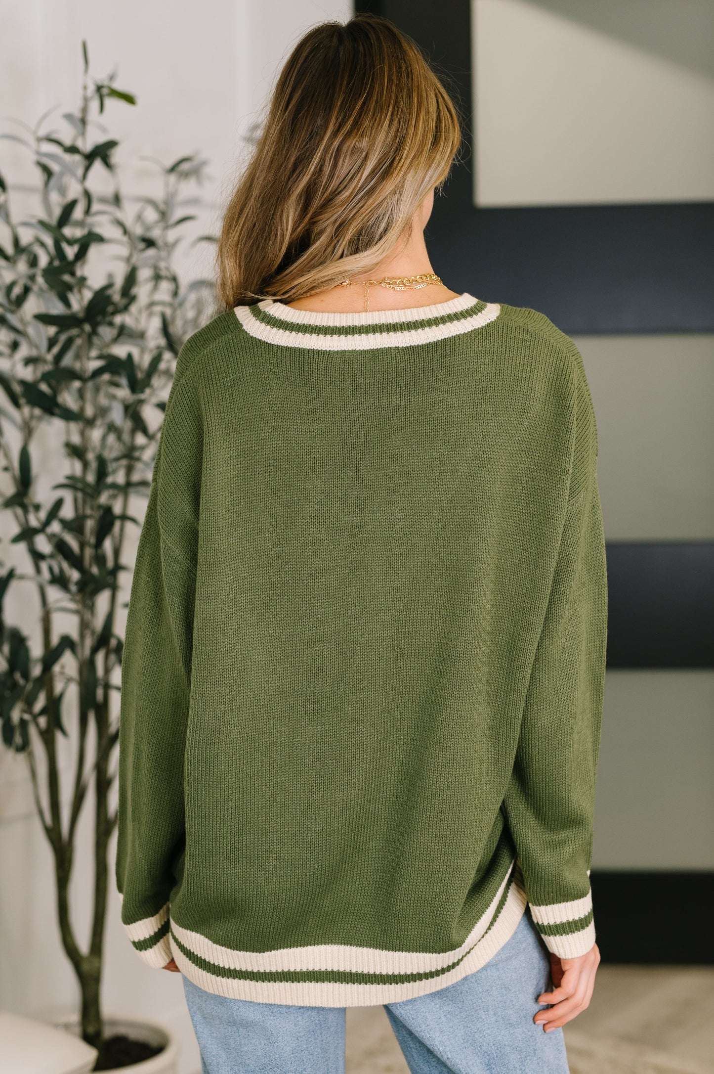 Back view of Somara Cardigan showing relaxed silhouette and mid-weight knit.