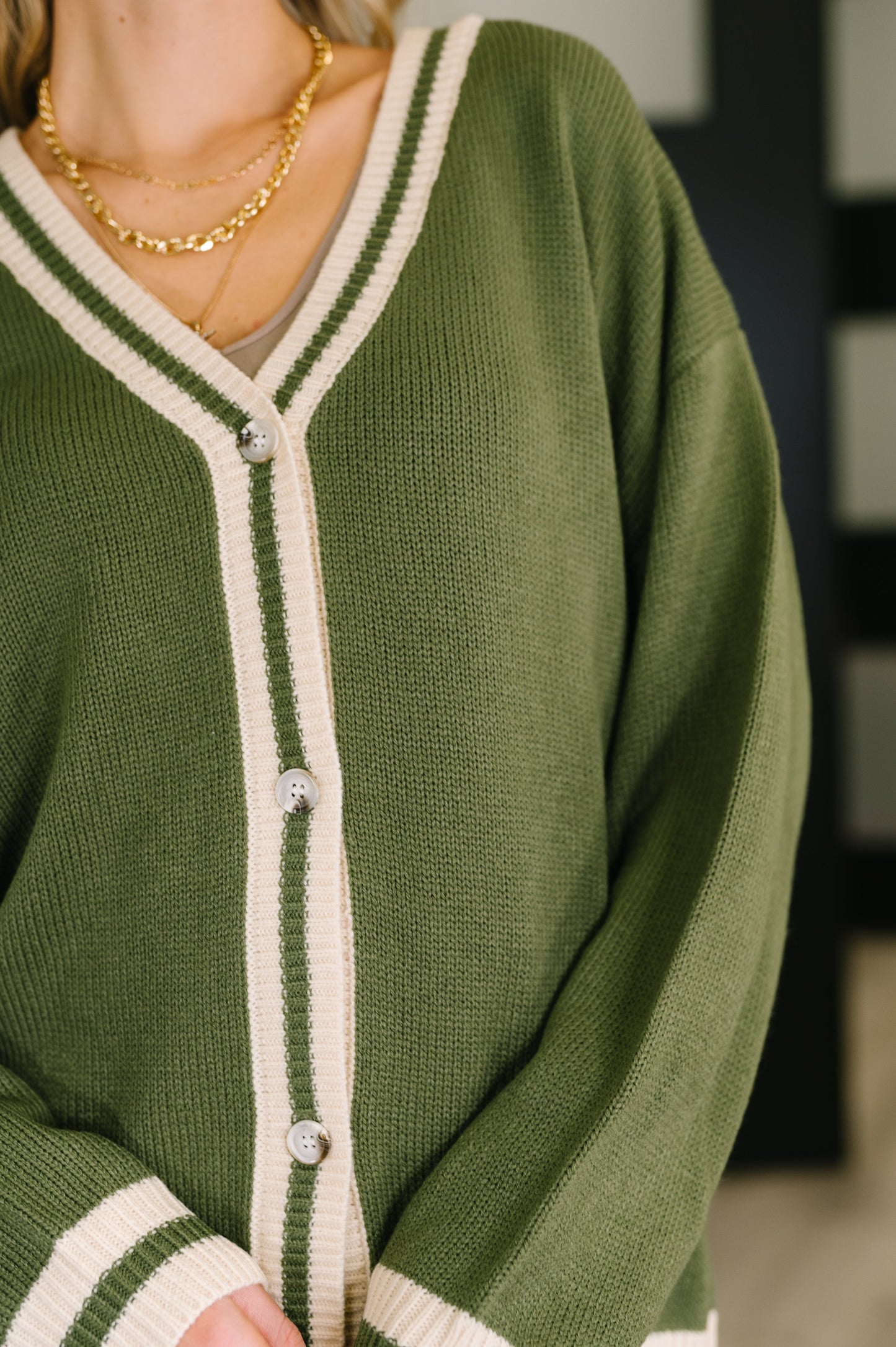 Close-up of Somara Cardigan showing deep V-neckline and ribbed detailing.