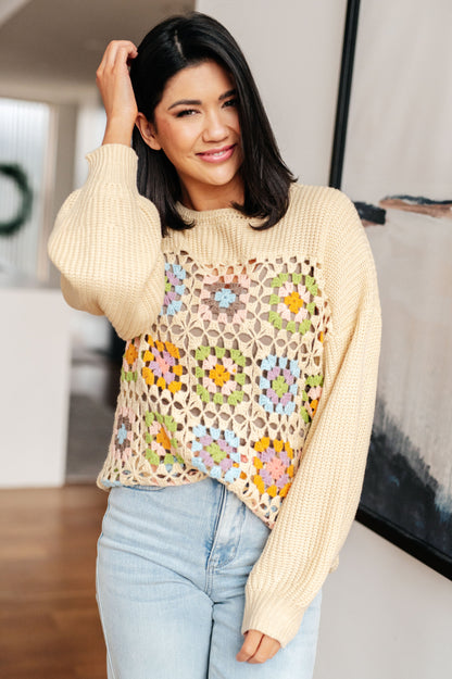 Model wearing Granny Square Sweater in beige with crochet knit lace accents.