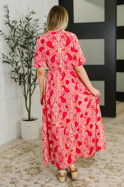 Back view of the Jemma Red Patterned Maxi Dress highlighting the gathered tiers and relaxed fit.