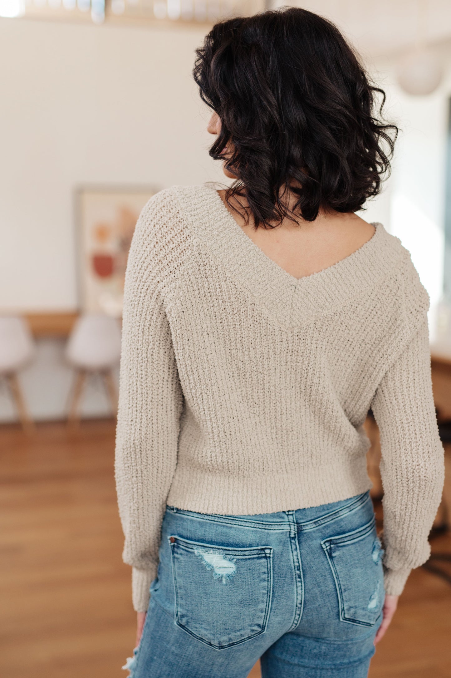 Back view of plus size Suki V-Neck Sweater showing V-neck and relaxed fit.