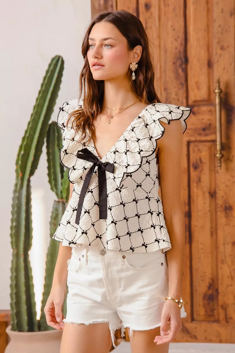 Sully Jacquard Top with bow tie and scallop neckline, versatile chic look.