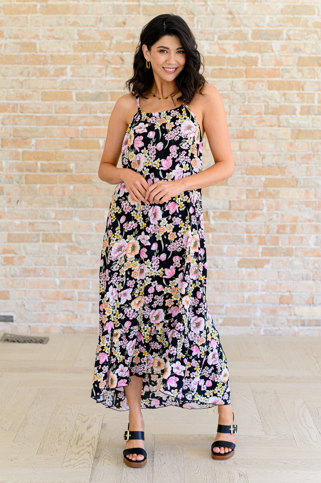 Front view of Samantha Halter Dress in black floral with ruffled hem and drawstring neckline.