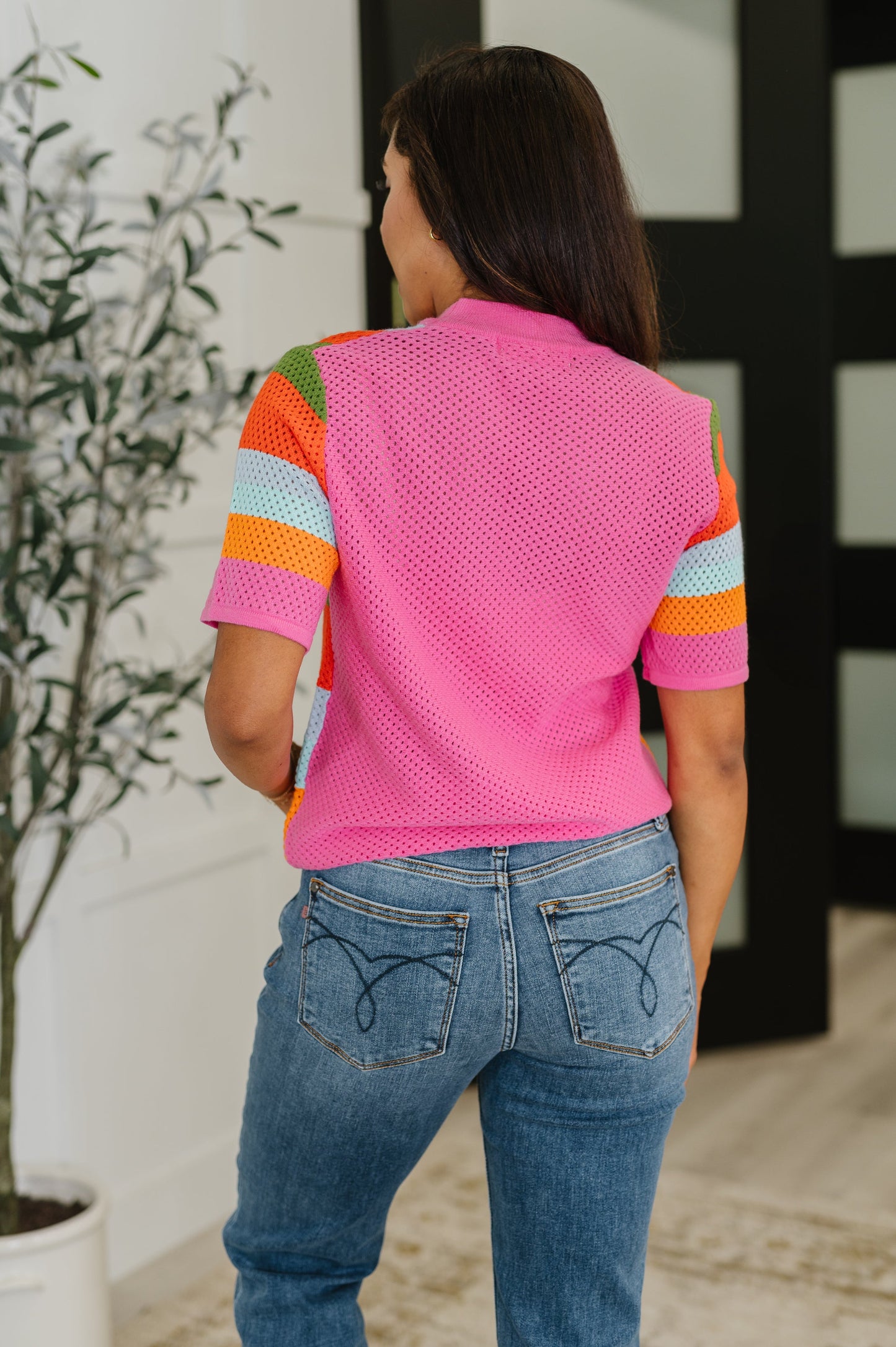 Back of Blyss Multicolor Knit Top with banded hemline and ribbed finish.