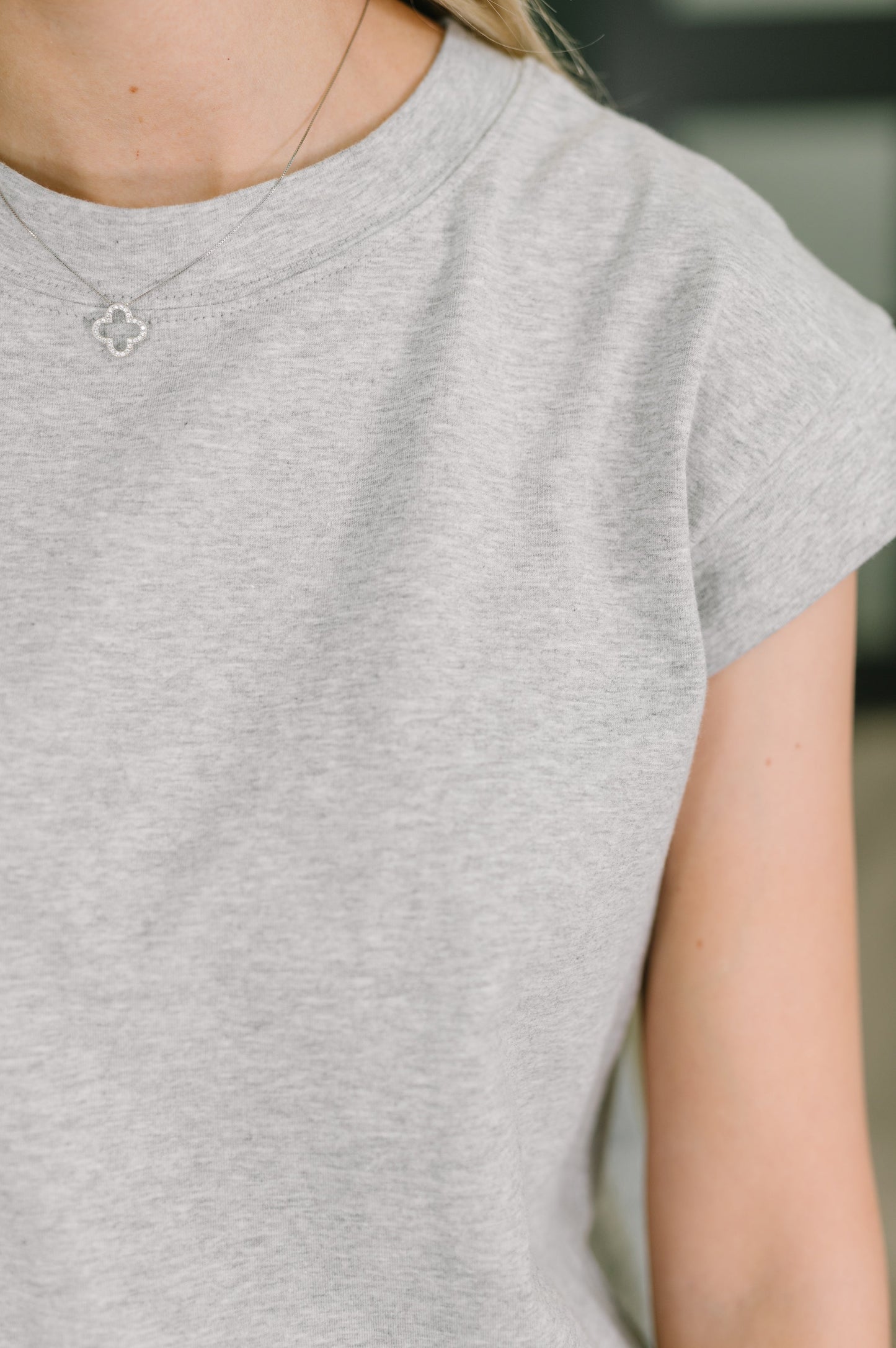 Close up of Sweeney Casual Dress in Heather Gray knit texture and neckline detail.