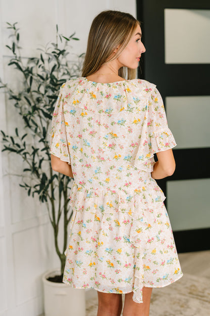 Back view of the Addison Boho Floral Dress highlighting the ruffle details and relaxed fit.