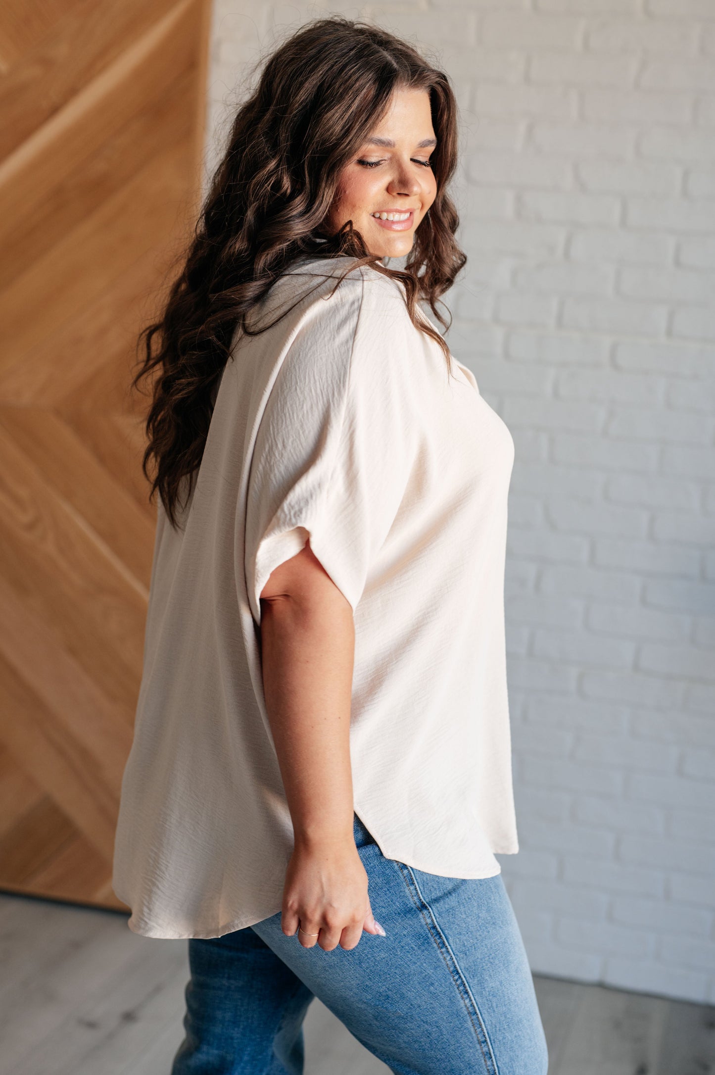 Women's Button Down Blouse in Oatmeal, featuring textured woven fabric, lightweight design, fold-over collar, short dolman sleeves, and button front closure. Perfect for a stylish, laid-back look.