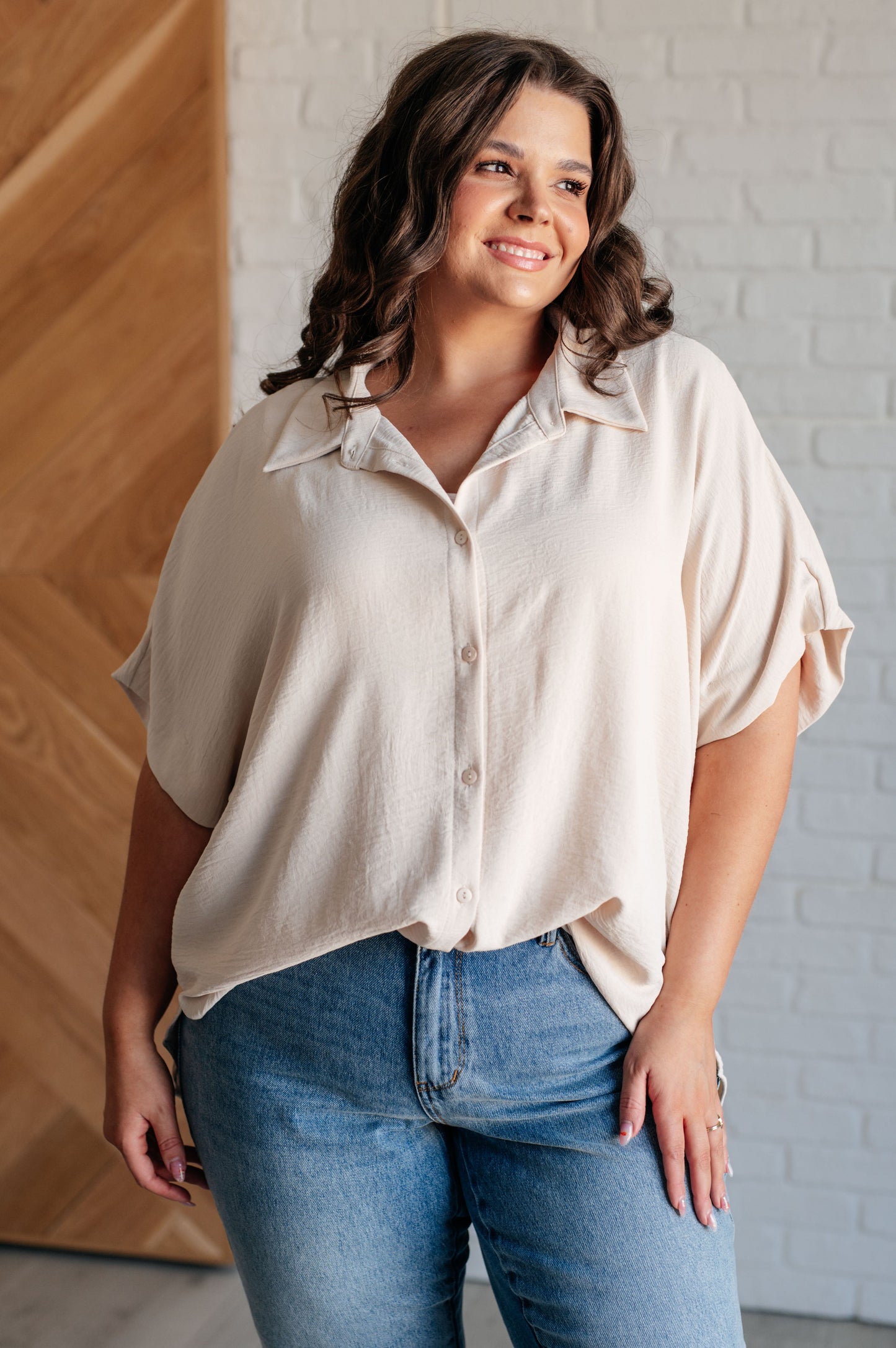 Women's Button Down Blouse in Oatmeal, featuring textured woven fabric, lightweight design, fold-over collar, short dolman sleeves, and button front closure. Perfect for a stylish, laid-back look.