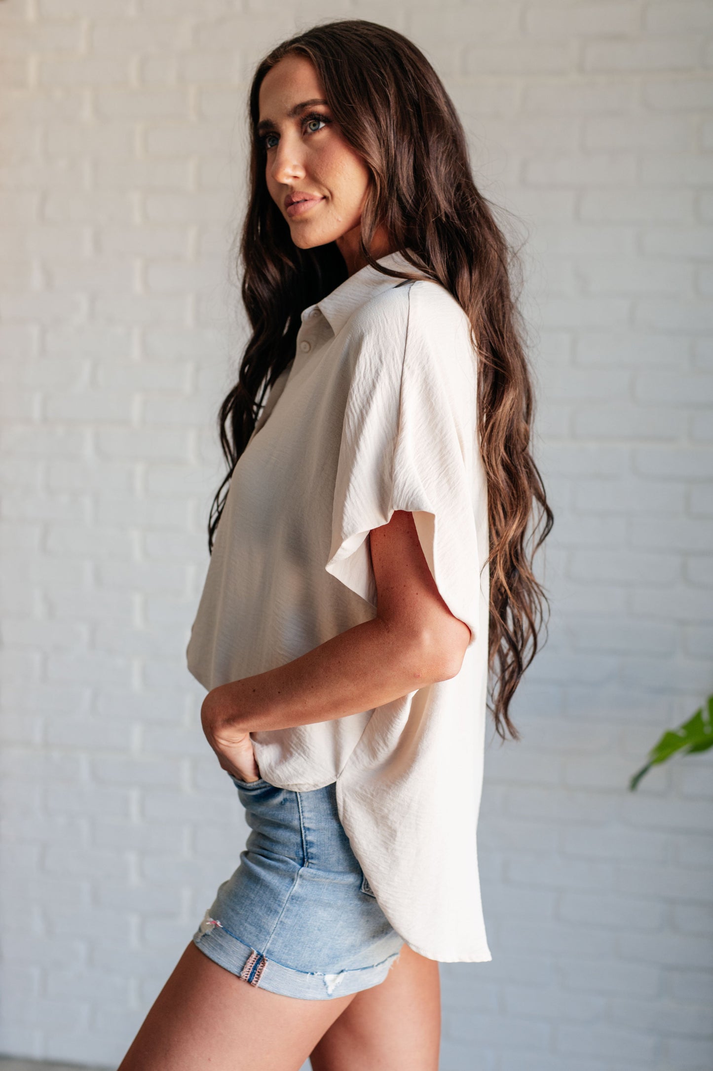 Women's Button Down Blouse in Oatmeal, featuring textured woven fabric, lightweight design, fold-over collar, short dolman sleeves, and button front closure. Perfect for a stylish, laid-back look.