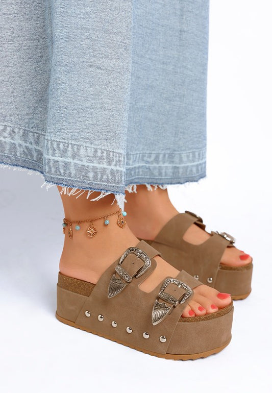 Taupe slip on sandals with chunky flatform sole and stud embellishments side angle.