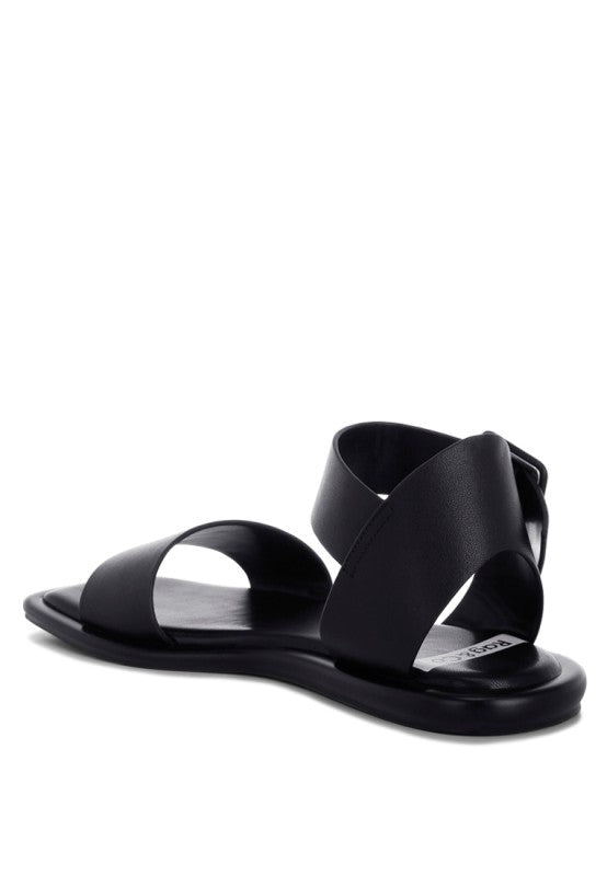 Angled view of Tayana Chunky Buckle Strap Flats modern sandal silhouette.