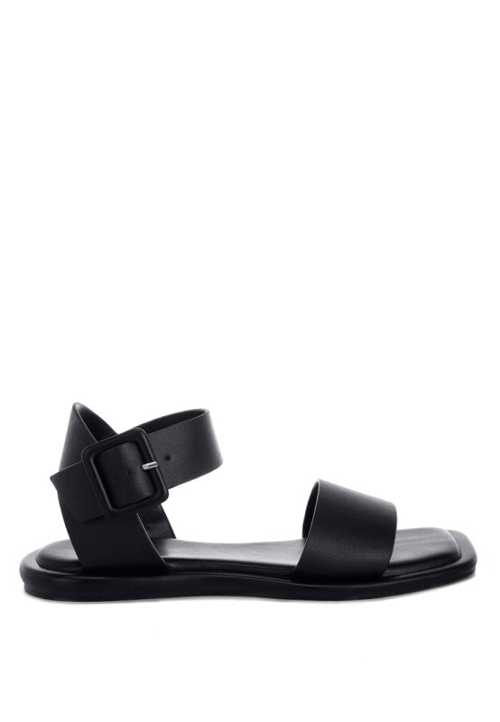 Side view of Tayana Chunky Buckle Strap Flats chunky buckle and leather upper.