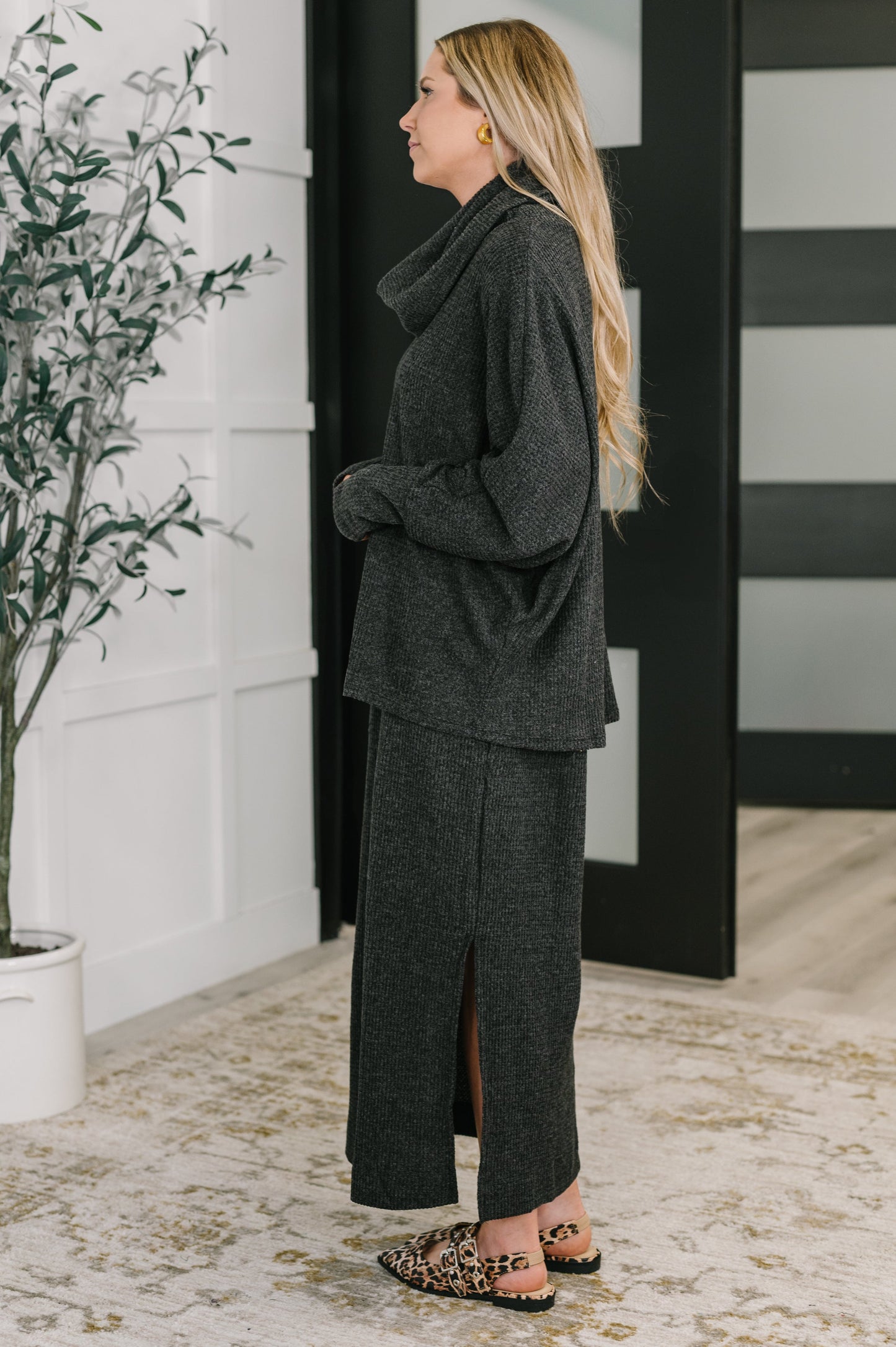 Side angle of Wannetta Set in Black highlighting relaxed silhouette and dolman sleeves.