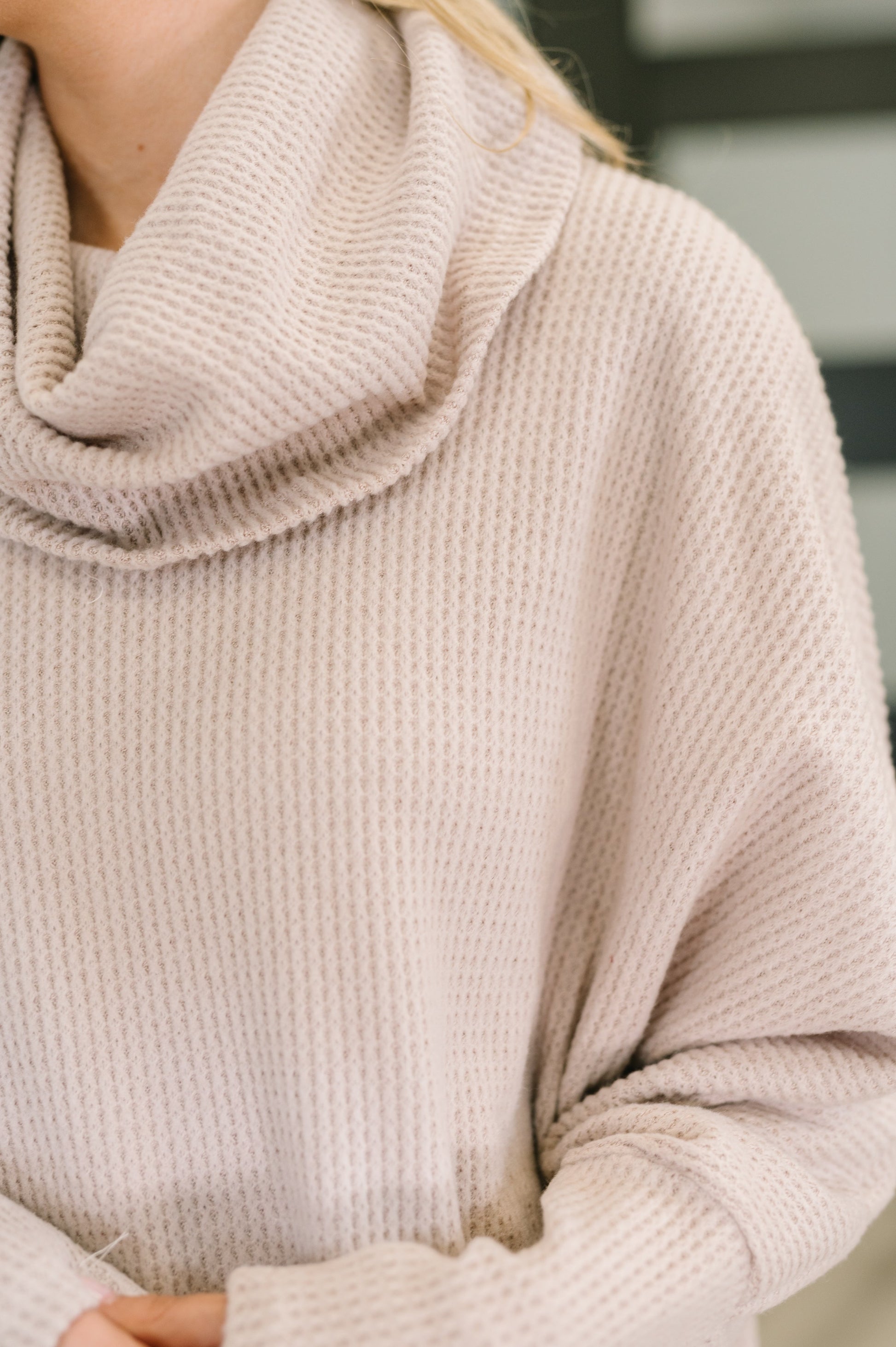 Close-up of Wannetta Set in Oatmeal showing cowl neckline and exaggerated sleeve cuffs.