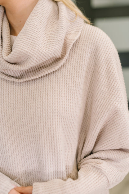 Close-up of Wannetta Set in Oatmeal showing cowl neckline and exaggerated sleeve cuffs.