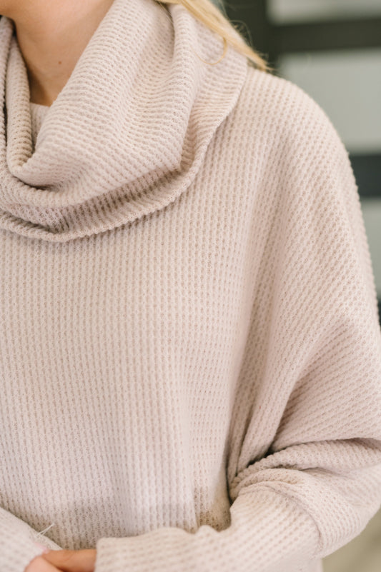 Close-up of Wannetta Set in Oatmeal showing cowl neckline and exaggerated sleeve cuffs.