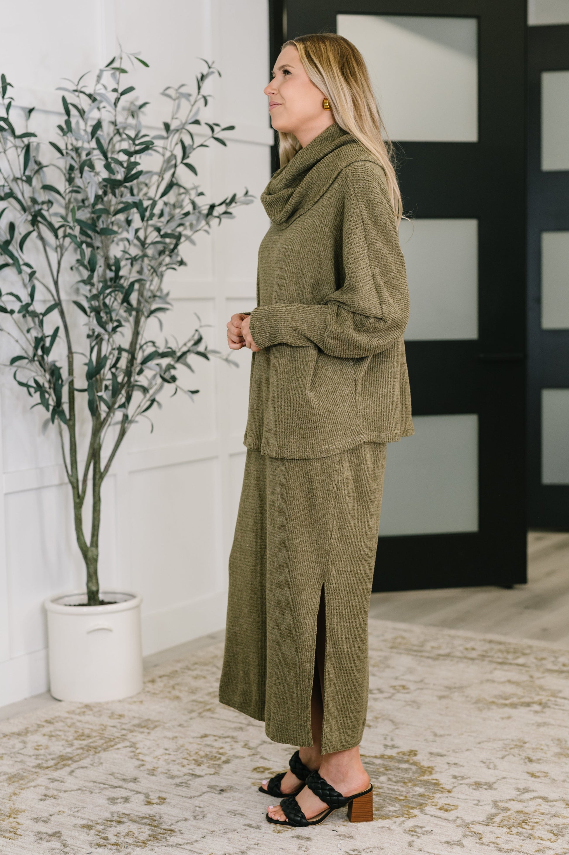 Side view of Wannetta Set in Olive showing dolman sleeves and airy side slits.