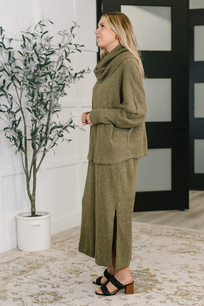 Side view of Wannetta Set in Olive showing dolman sleeves and airy side slits.