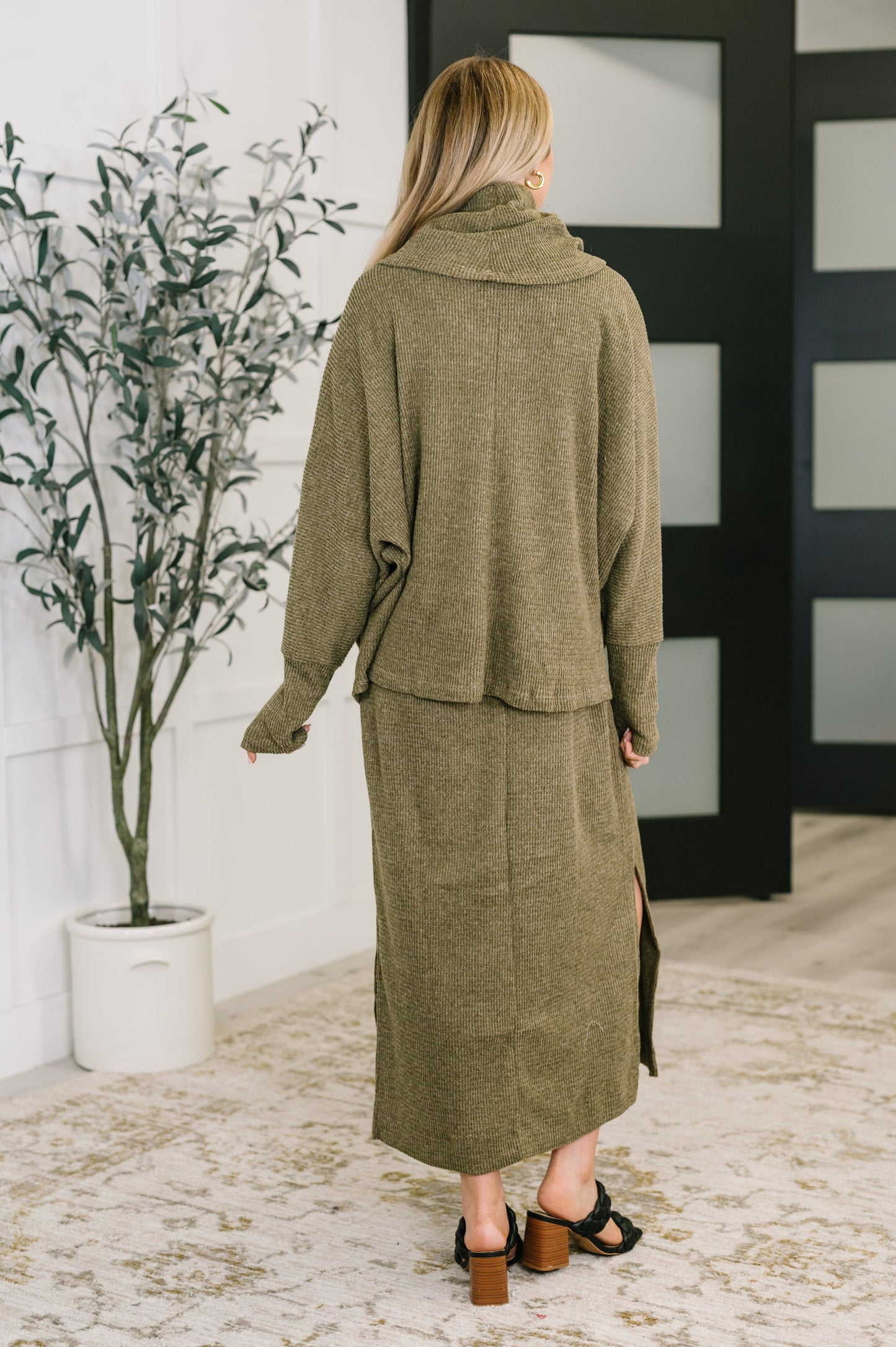 Back view of Wannetta Set in Olive with long sleeve cowl neck top and smooth knit texture.
