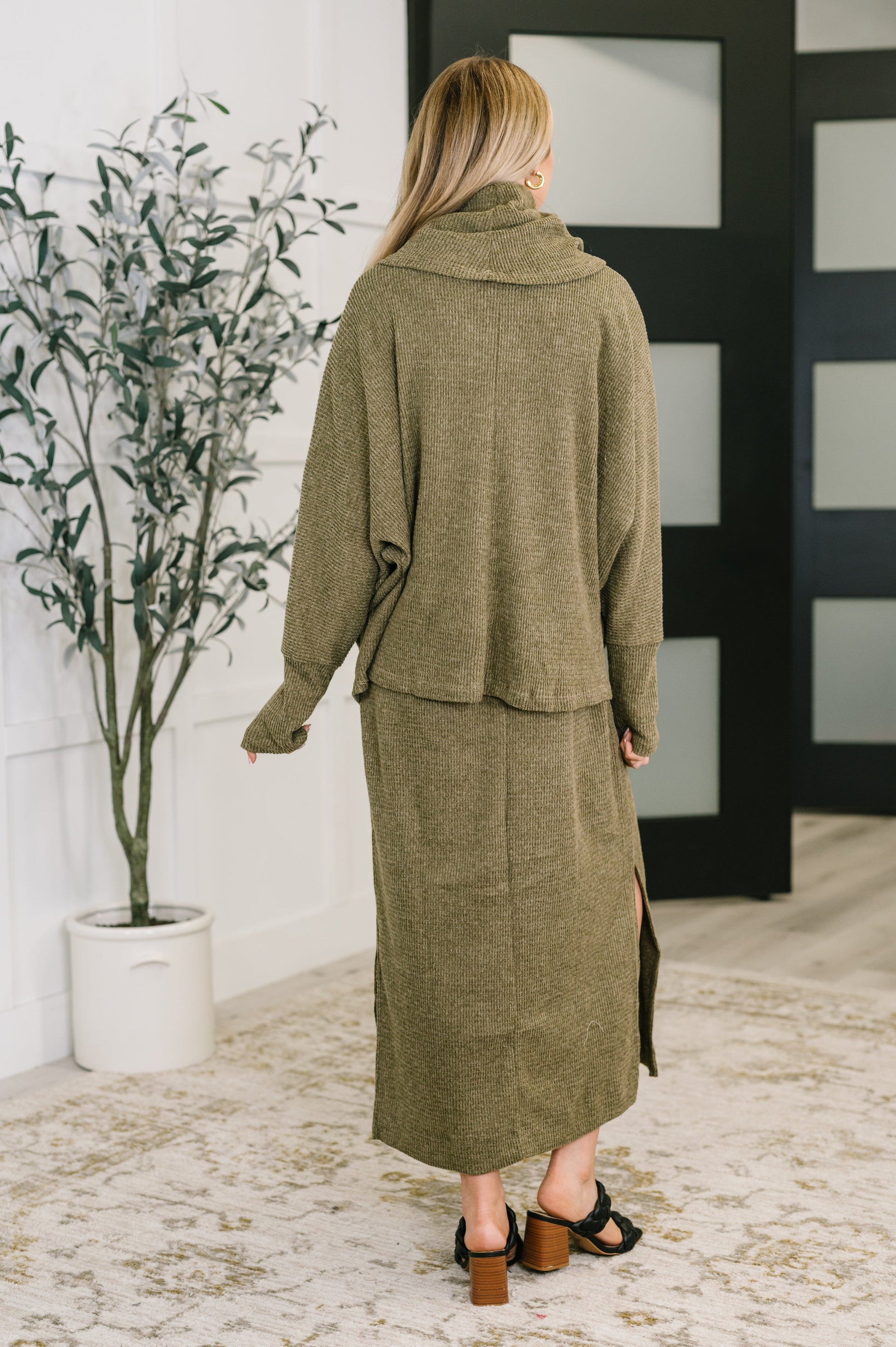 Back view of Wannetta Set in Olive with long sleeve cowl neck top and smooth knit texture.