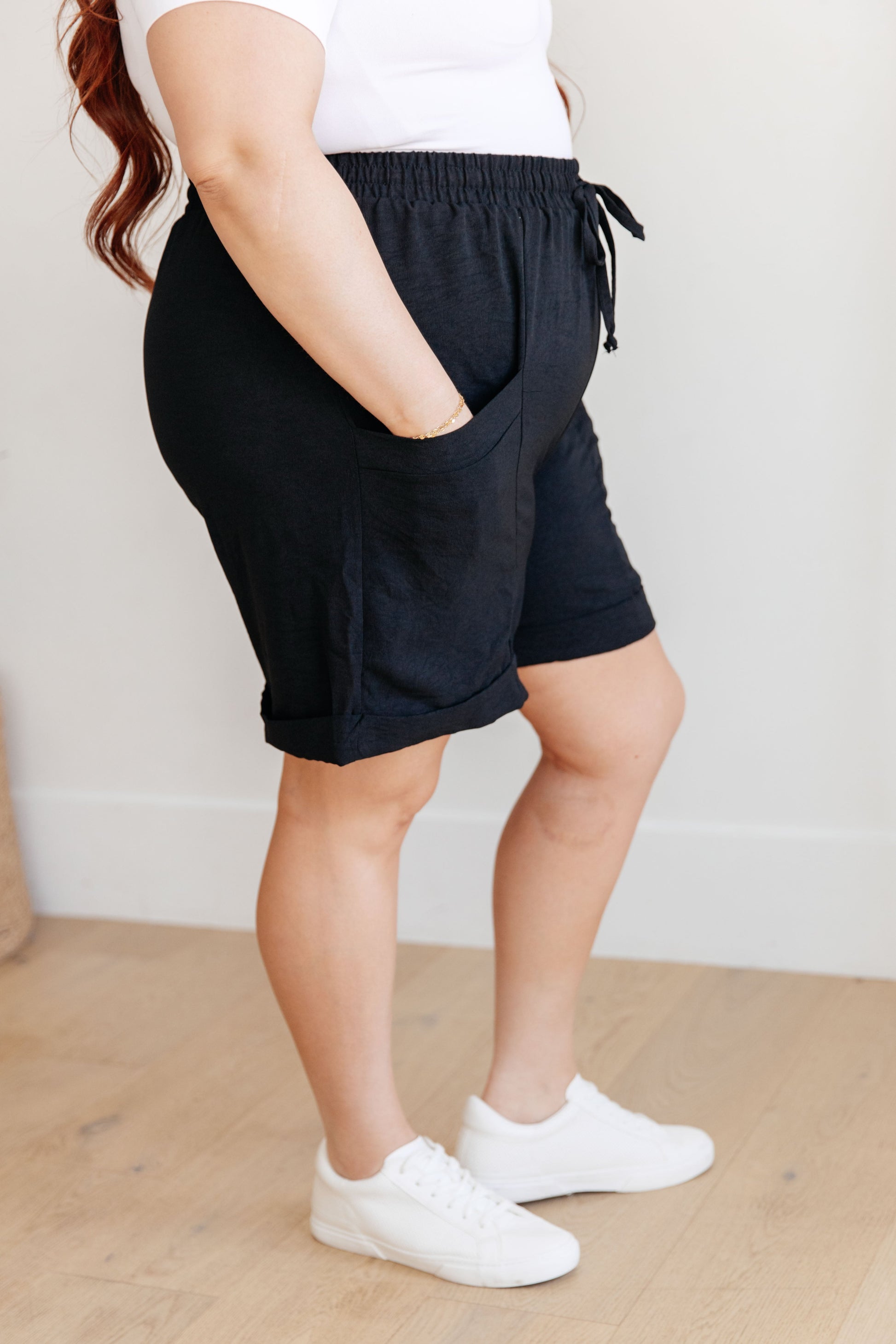 Plus size side view of Gracelyn Black Drawstring Shorts with functional drawstring waistband.