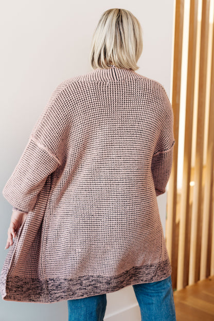 Plus size model back view of Ginni Mauve Cardigan, exposed seam detail
