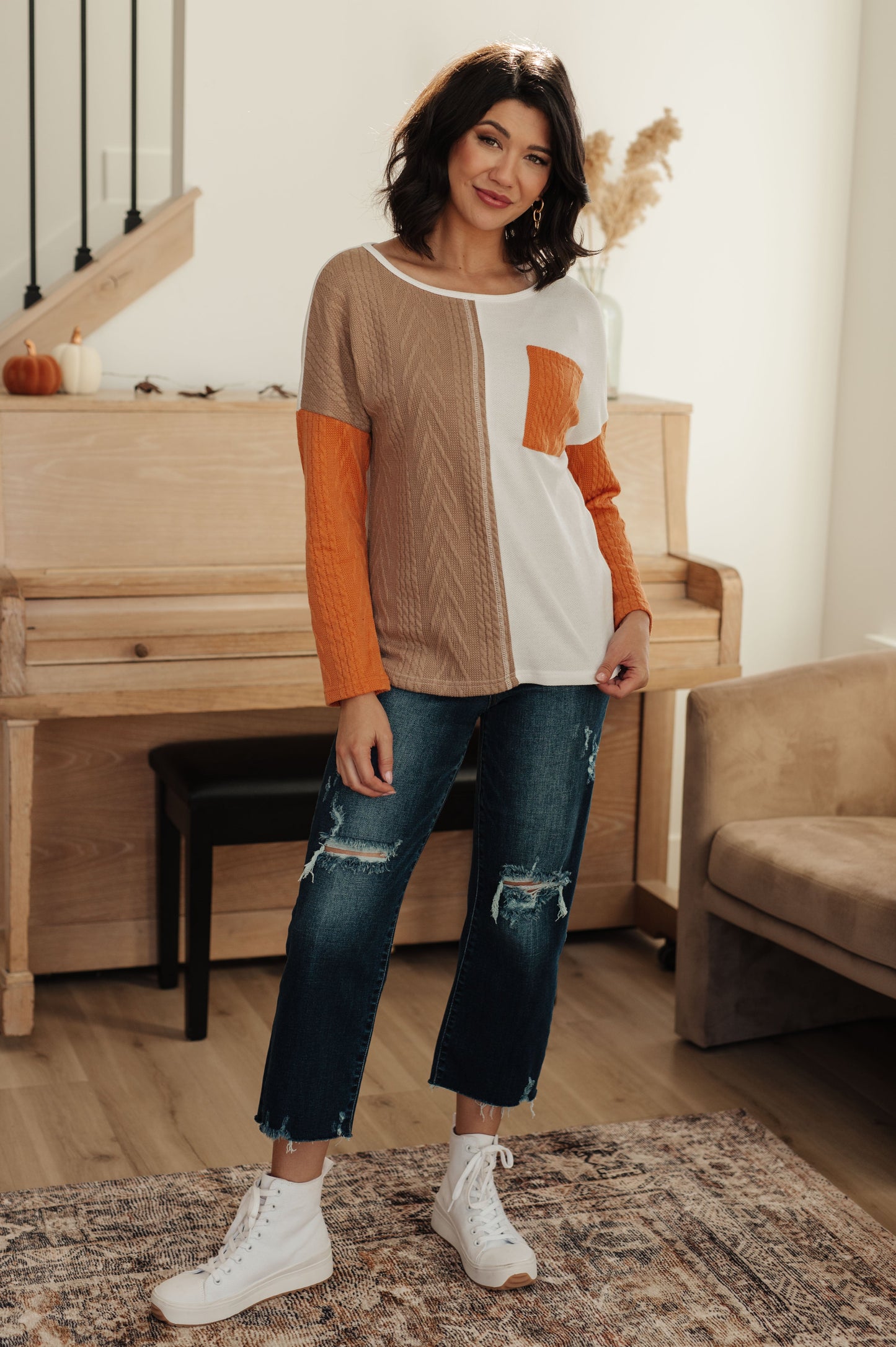 Full body view of Cleo Colorblock Top styled with jeans